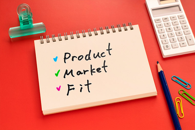 cuaderno con un escrito que dice Product Market Fit